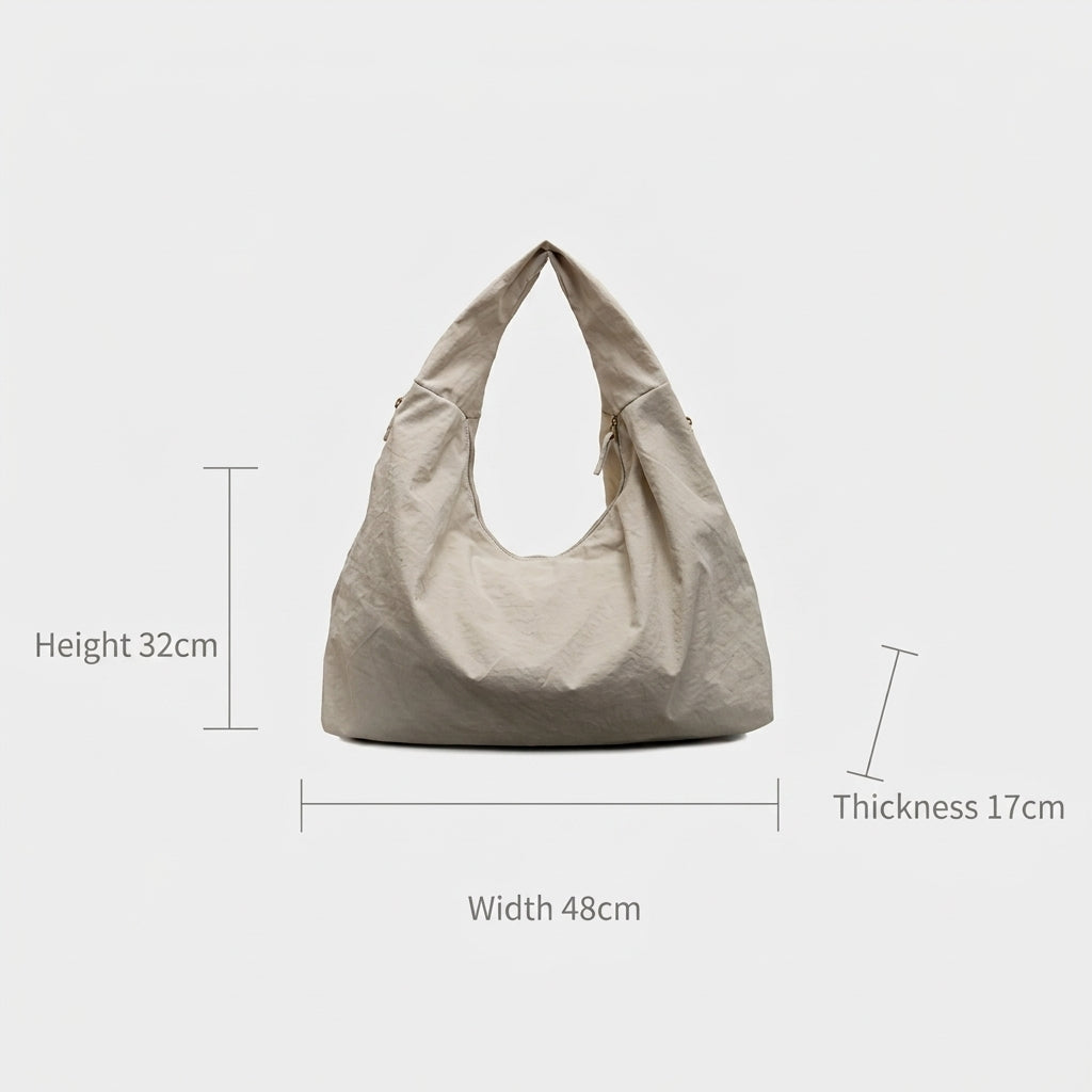 Sac fourre-tout hobo femme en tissu froissé, poches zippées et forme demi-lune