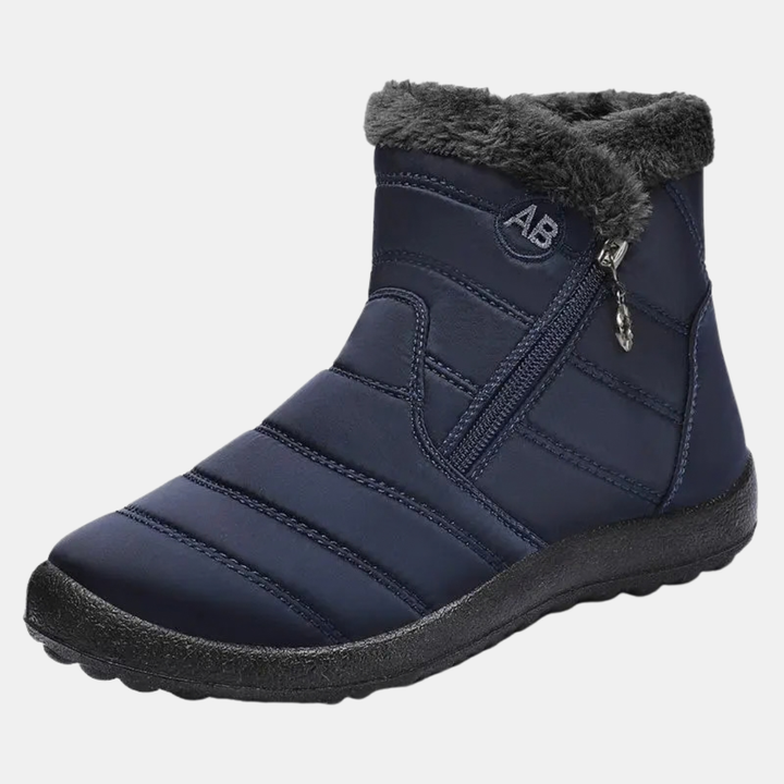Bottines après-ski femme matelassées, col en fausse fourrure, coloris bleu marine