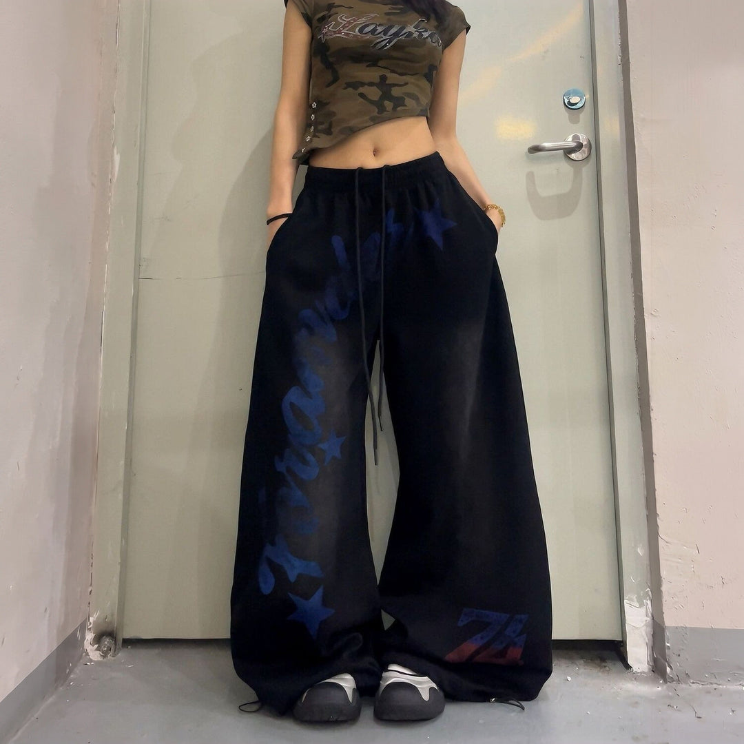 Jogging femme large oversize baggy, imprimé étoiles et lettrage délavé